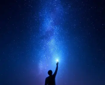 man trying to touch stars