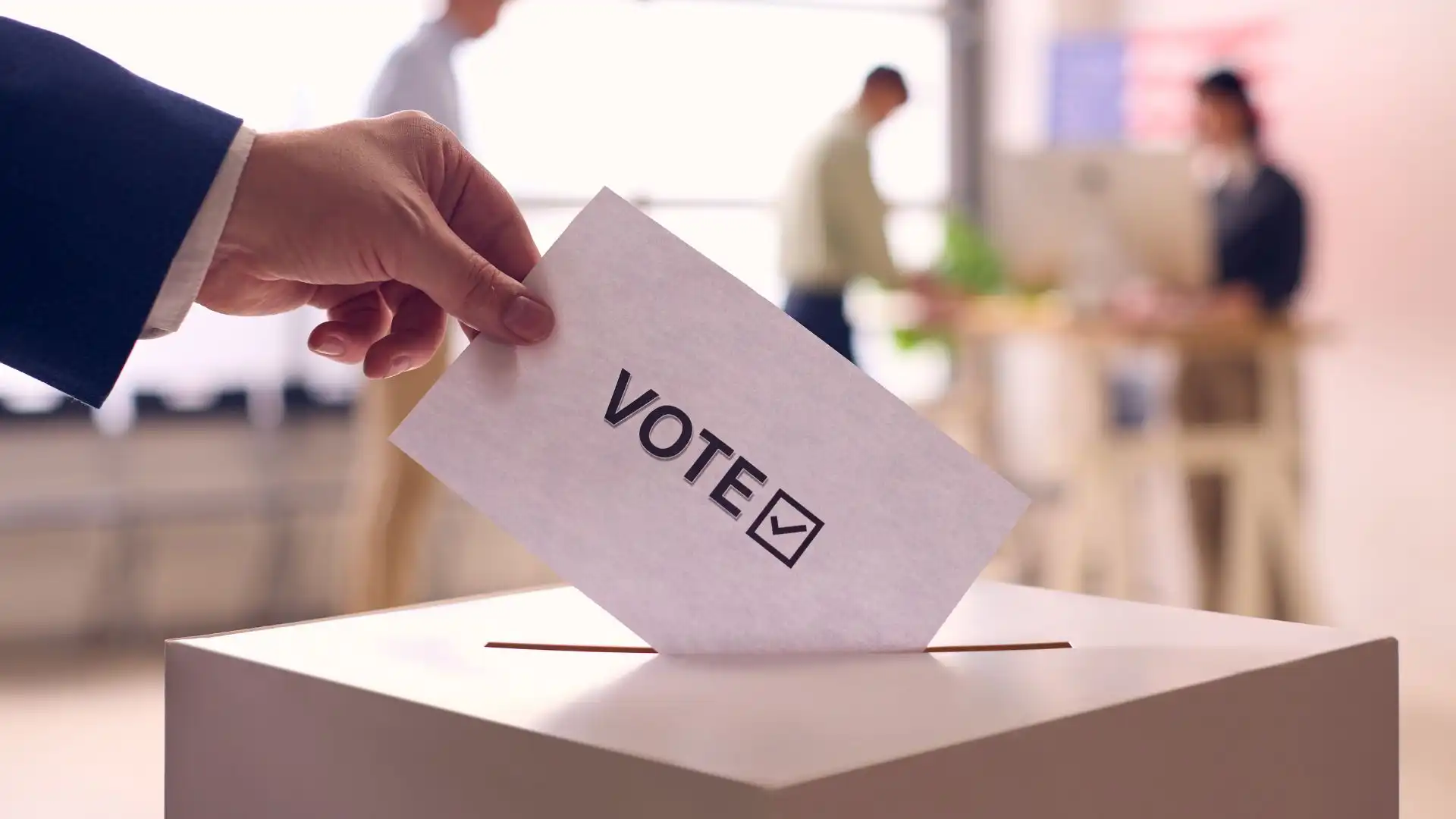 A man dropping a vote in the balot box